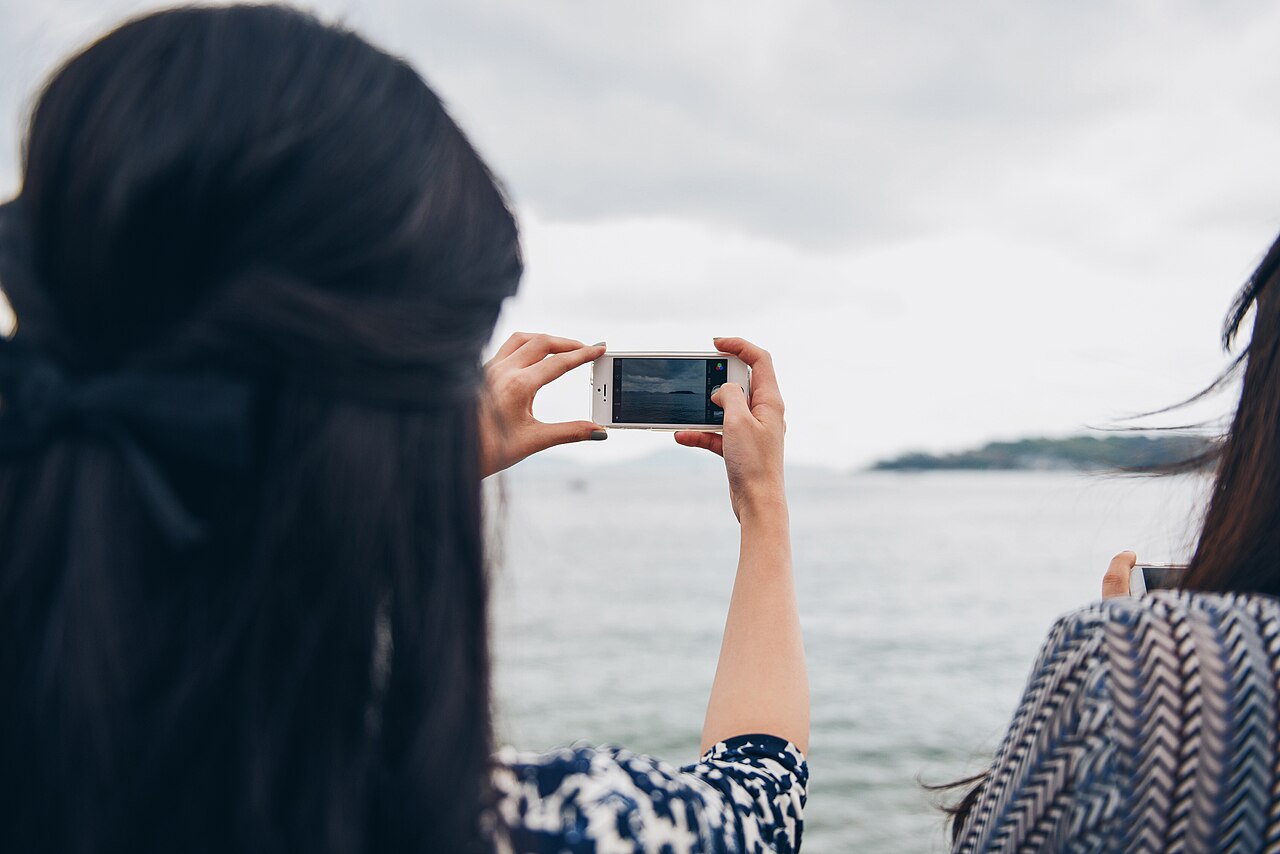 A person using a smartphone outdoors